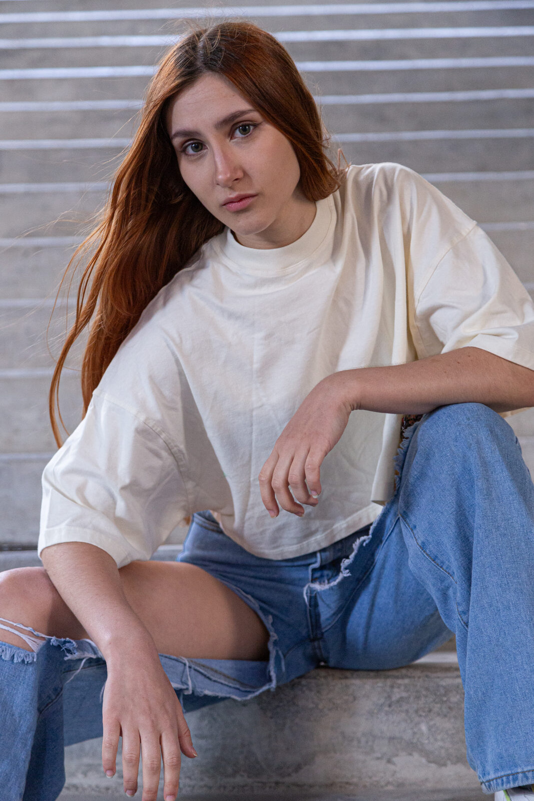 Cream oversized BLEACH tee, side-patch detail